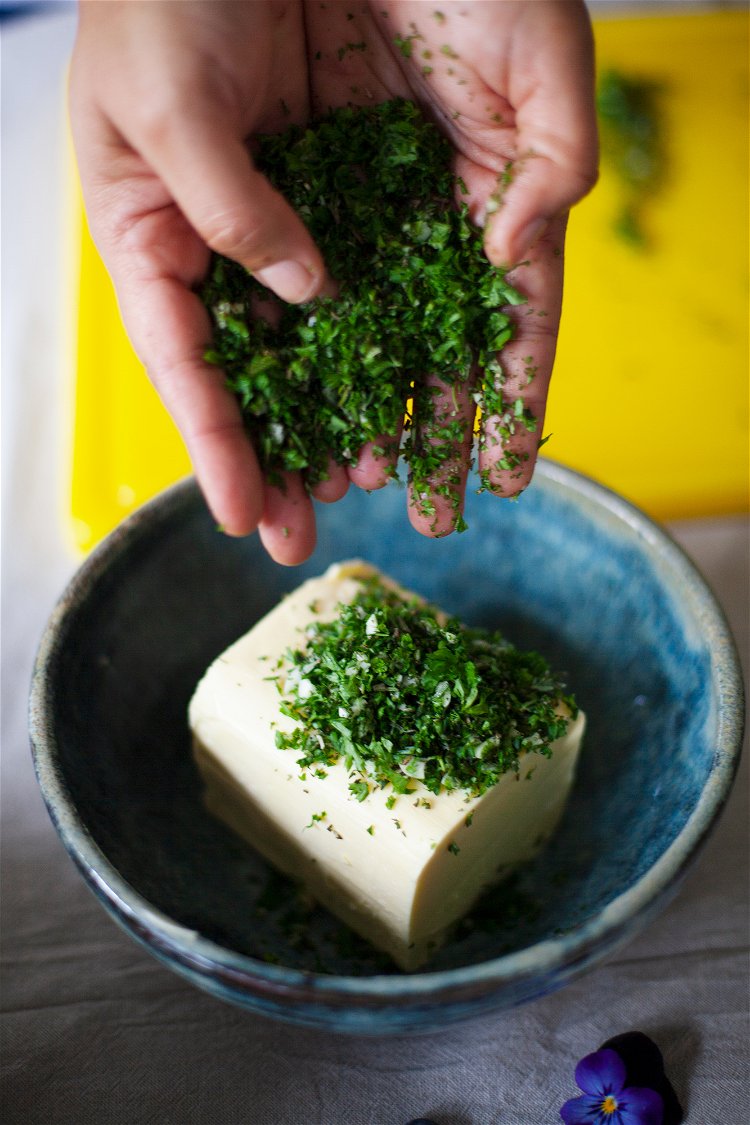 Image of In a bowl, place the butter and set it aside.