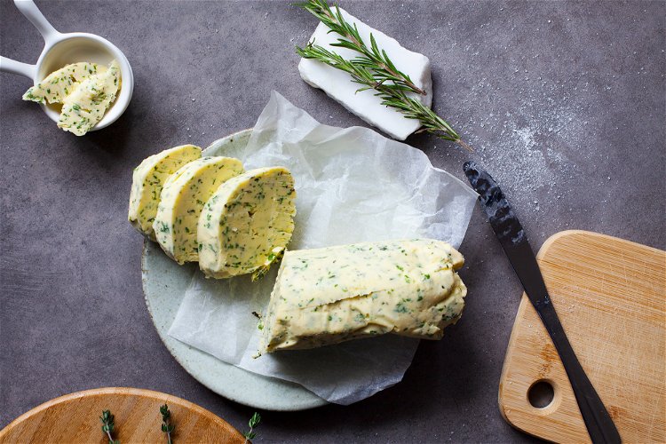 Image of Use half of the herbed butter to place under the...