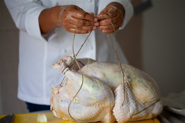 Image of Massage the remaining butter over the outside of the turkey,...