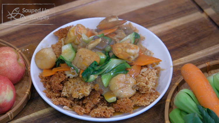 Image of Fish out the rice crackers and put them on a serving plate. Immediately serve the seafood soup all over the top and enjoy the sizzling sound.