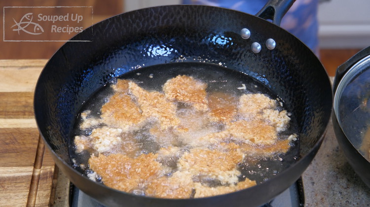 Image of Bring the oil to 400°F. Fry the rice crackers for 30-40 seconds or until the crackers are golden brown.