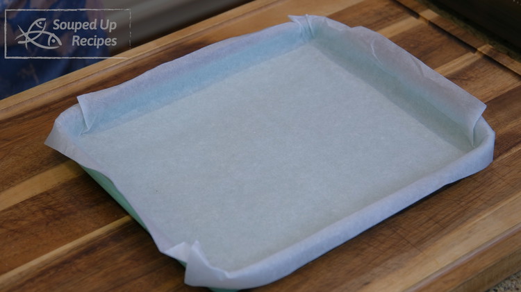 Image of Wrap a baking pan with parchment paper. Don't use tin foil because the rice sticks.