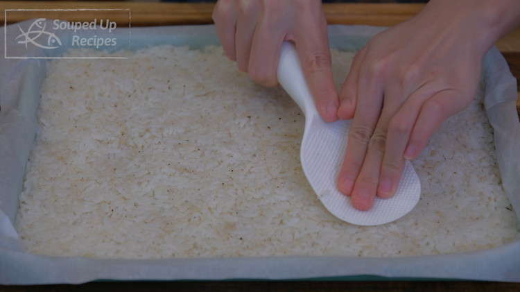 Image of Even spread the rice in the baking pan and press it down tightly so the grains don't separate from each other during the dehydration. Also, the thickness of the rice should be about 1/3 of an inch. If it is...