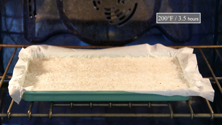 Image of Stick the rice tray into the oven. Set the temperature to 200 F, and let it dry for 3.5 hours. During this time, come back ever 30 minutes to open the oven to release the steam.