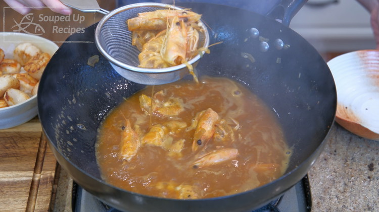 Image of Use a sieve to fish out the solid ingredients. Now, you have made a rich, flavorful shrimp stock.