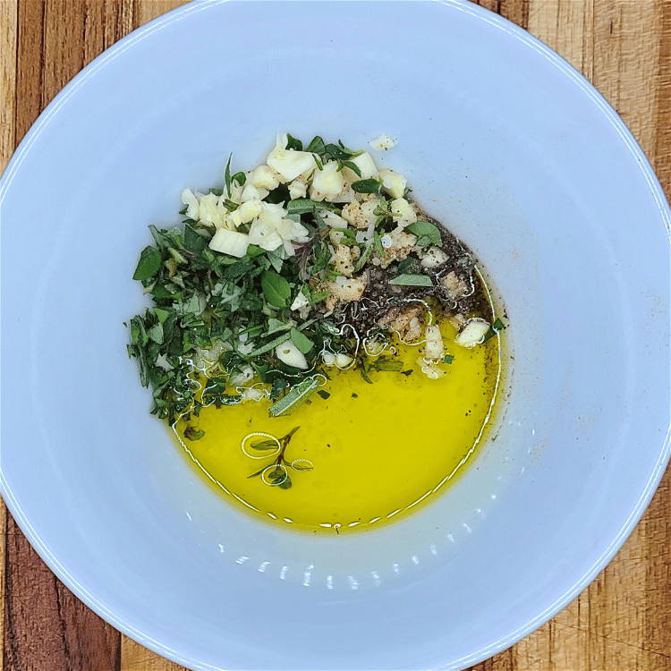 Image of Combine the olive oil, garlic and herbs in a small...