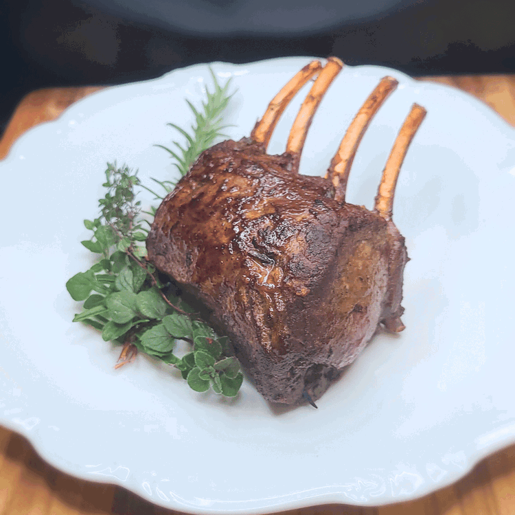 Image of When meat is done, let it rest for 5-10 minutes, then slice each medallion between each bone into 2 slices and sprinkle with a bit more salt.