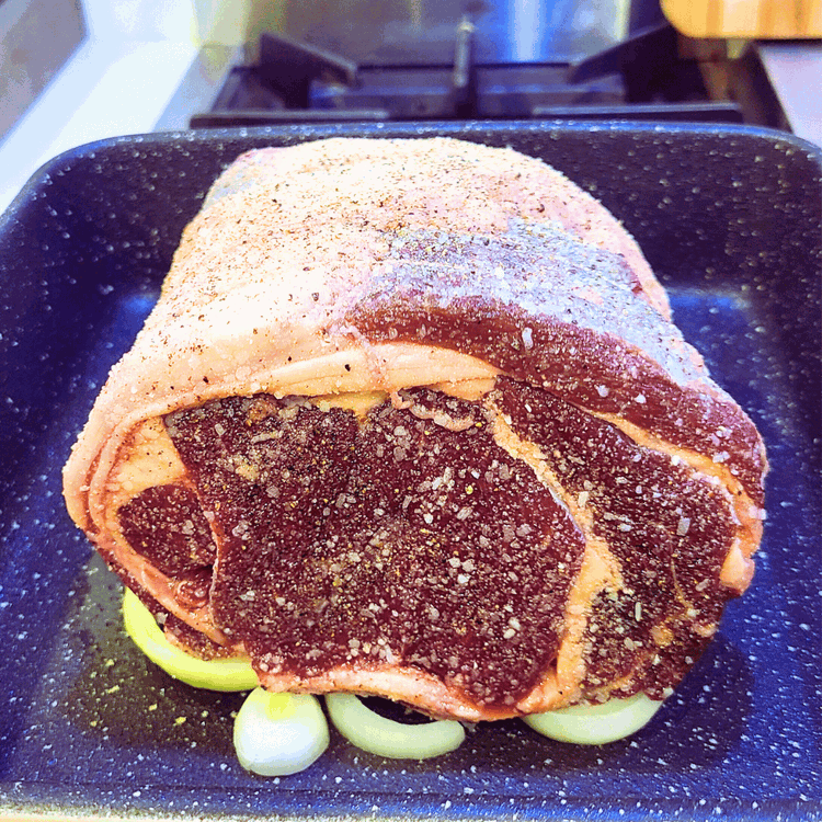 Image of Place the roast on an oven rack in your pan. 