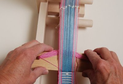 Image of Push the open (non-heddle threads) warp threads down, blue (threads...