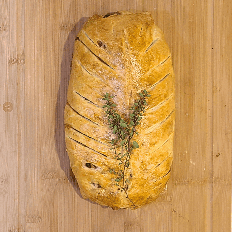 Image of Bake until pastry is golden and the center registers 125°F for medium-rare, about 40 minutes. Let the Wellington rest for 10 minutes before carving into thick slices and serving.