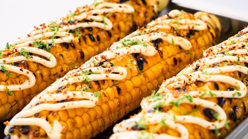 Image of Grilled corn with mayo, lime and tajin