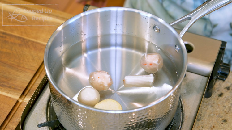 Image of Fill a pot with water and add some frozen Chinese meatballs. Your local Asian market may have a lot of varieties, but any of the following options will be good: fish, squid,  shrimp, beef, or pork meatballs. 