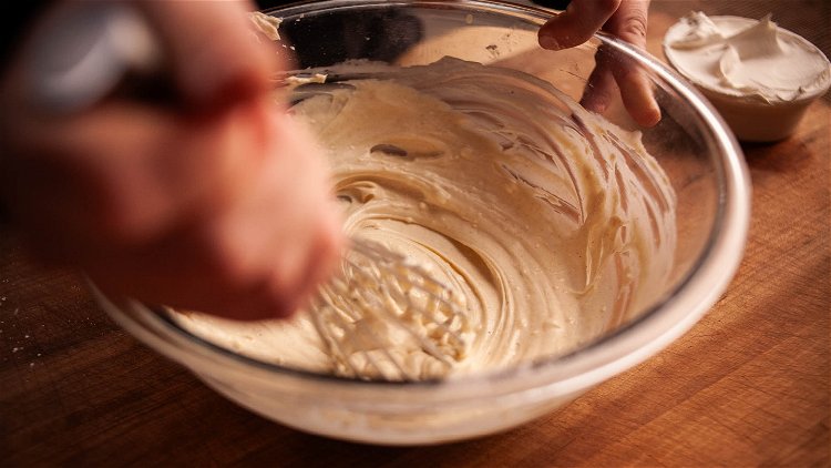 Image of Place the softened cream cheese in a mixing bowl with...