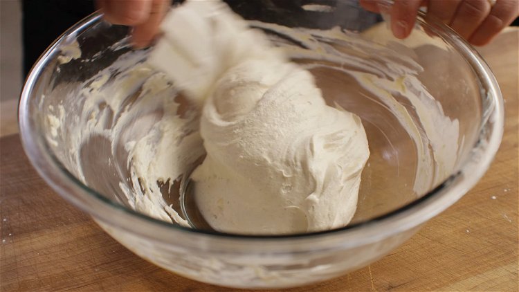 Image of Gently fold in the Cool Whip with a spatula until...