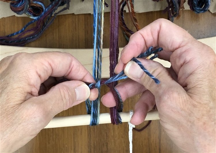 Image of Tie a surgeon’s knot: bring the ends together and wind...