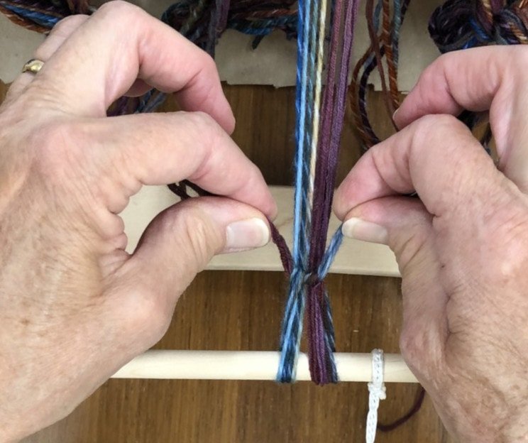 Image of Tighten by pulling on the ends.