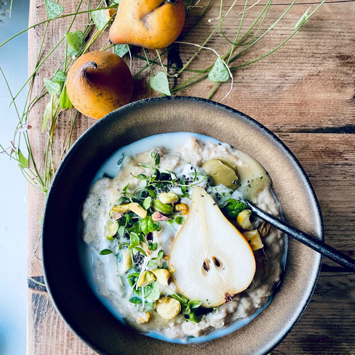 Poached Pear With Honey & Pistachio Porridge