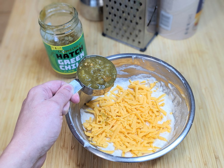 Image of Fold in the shredded cheese and Chopped Chile Co. Green Hatch Chiles.