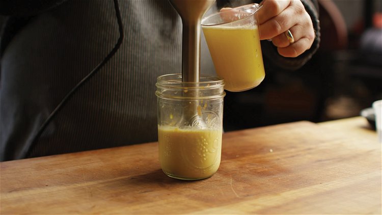Image of Combine the egg yolks, warm water, lemon juice and hot...