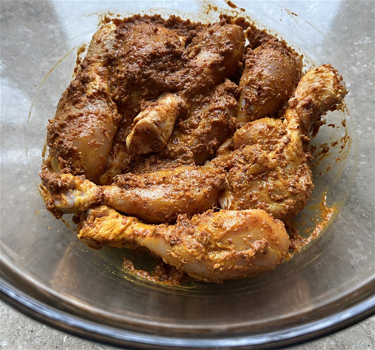 Image of Add the curry paste to the chicken and mix until...