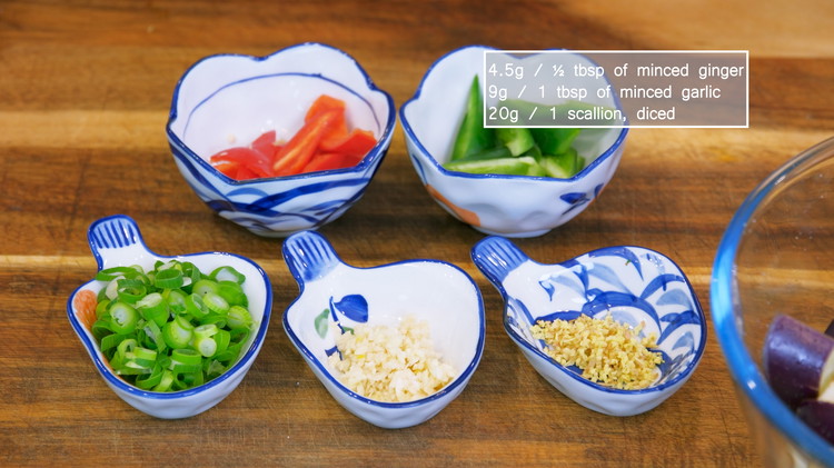 Image of While waiting, cut one red chili and one green chili into bite-size pieces. If you don't eat spicy food, you can use bell peppers. Finely mince ½ Tbsp of ginger and 1 Tbsp of garlic, and dice one scallion. Separate...