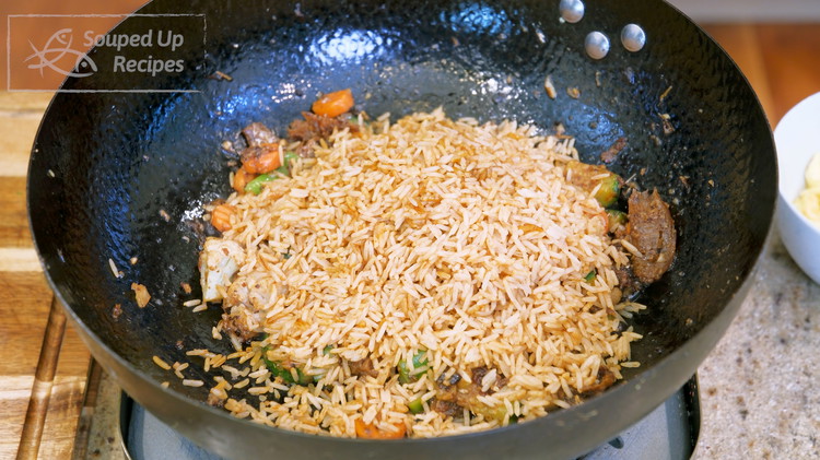 Image of Add the rice and switch the heat to high. Keep stirring for 2-3 minutes. If you are using noodles, this is also the point to add the noodles.