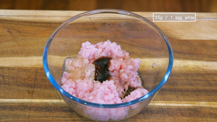 Image of Combine the ground fish meat with the fried dace. Add ½ tsp of ground white pepper, 1.5 tbsp of fish sauce, 2.5 tsp oyster sauce, and 1 egg white and stir everything in one direction until well combined.