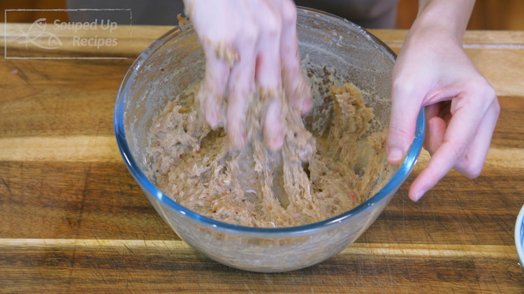 Image of Once done, grab the mixture and hit it against the mixing bowl with some force. This helps to generalize the meat and gives the meatballs a bouncy texture. You must do this for 4-5 minutes or until your arm is...