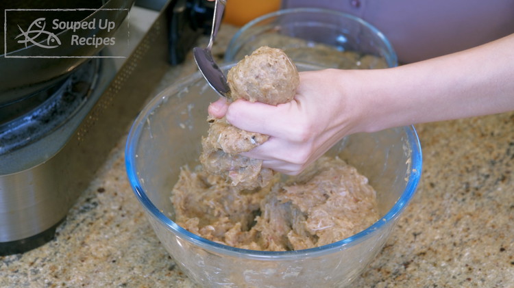 Image of Grab a big batch of fish meat mixture and squeeze it. It will naturally form a meatball in between your thumb and forefinger. Dip a spoon in water to prevent sticking, then scoop the fish meatball and carefully drop it...