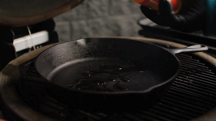 Image of Preheat a Lodge 12” Cast Iron Skillet inside the grill...