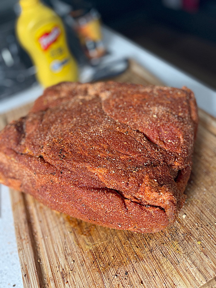 Image of 7-10 days has passed, so now remove all cure, apply mustard all over then season with Oz Dirt