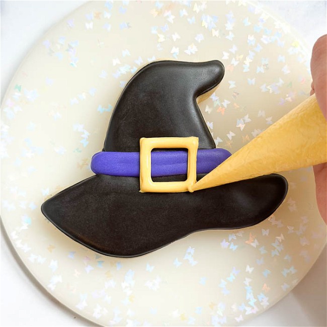 Image of Decorating a Witch Hat Cookie for Halloween