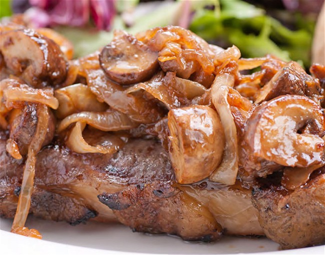 Image of Grilled New York Steak, Mushrooms, and Onions