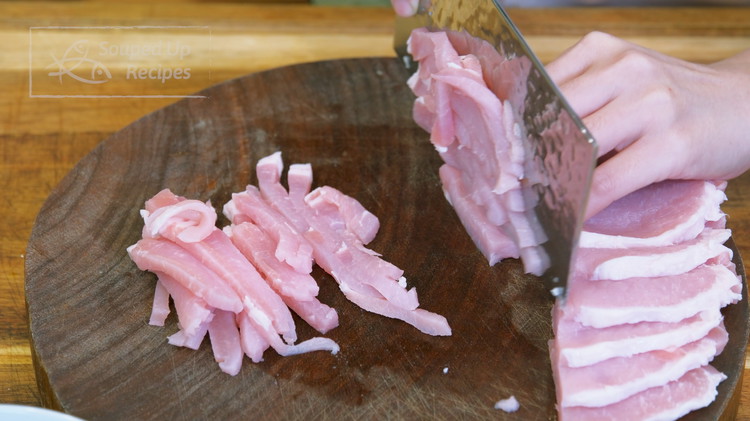 Image of Cut the pork into 1/4-inch thick slabs. Stack the slabs and julienne them into strips. I am using pork loin, but pork butt and pork belly will also work.
