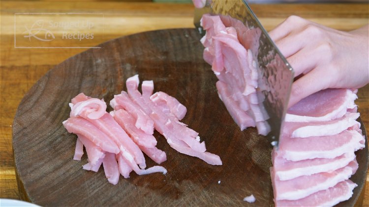 Image of Cut the pork into 1/4-inch thick slabs. Stack the slabs...