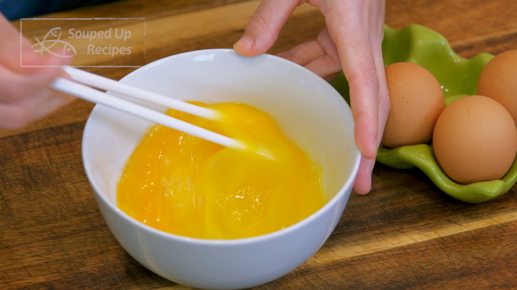 Image of Crack 3 medium size eggs into a bowl and beat them well. Moo Shu (Mù Xī/木樨 in Chinese) originally denotes sweet osmanthus, but now, it is an elegant name to depict the scrambled eggs because they resemble the yellow blossoms...