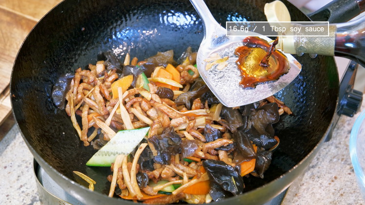 Image of Add 1 tbsp soy sauce from the side of the wok. You want to hear the sizzling sound. That means the soy sauce is camelizing and that is how you create beautiful complex flavors.