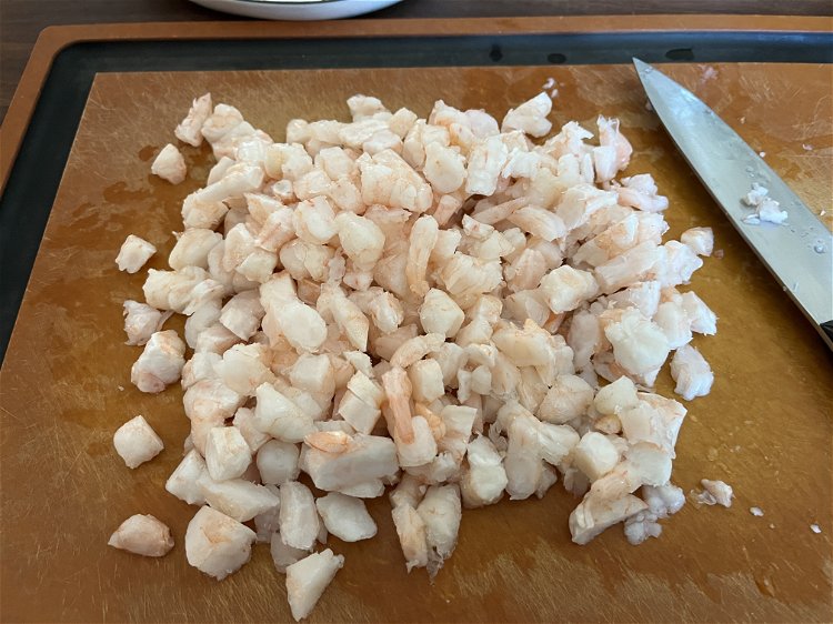 Image of Cut shrimp into small, bite sized pieces and place in...