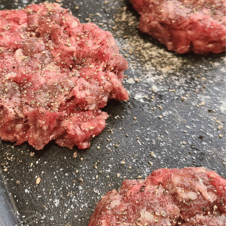 Image of Divide into 6 equal portions. Roll into balls then flatten slightly and season with salt, pepper and garlic powder