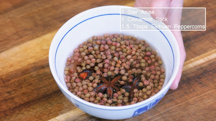 Image of Soak 2 star anises, 1 cinnamon stick, and 1.5 tbsp of Sichuan peppercorns. in hot water for about 20 minutes because if they are dry, they will burn fast in the oil. A little bit of moisture will give them...