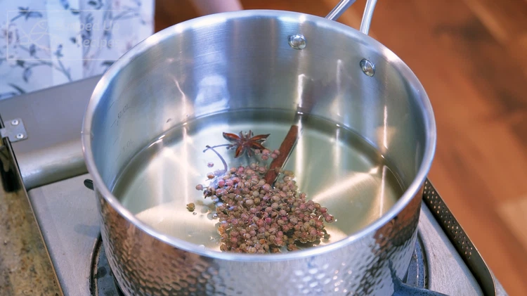 Image of Drain the star anise, cinnamon stick, and Sichuan peppercorns and add them to the oil.