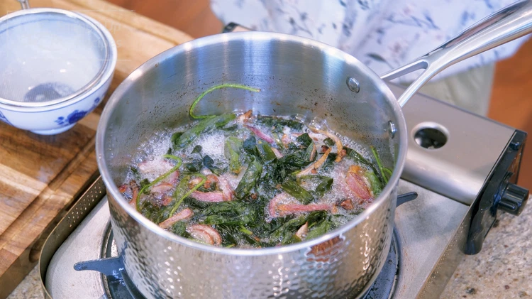 Image of Turn the heat to medium and stir all the aromatics constantly for about 20 minutes or until the aromatics are golden on the edge.