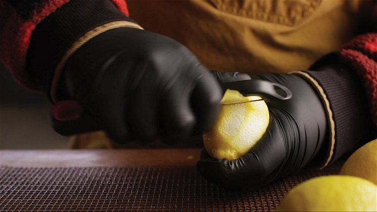 Image of Using a peeler, remove the zest from the lemons in...