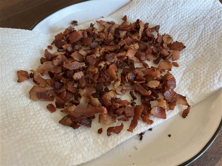 Image of In a Dutch oven, add chopped bacon and cook until...