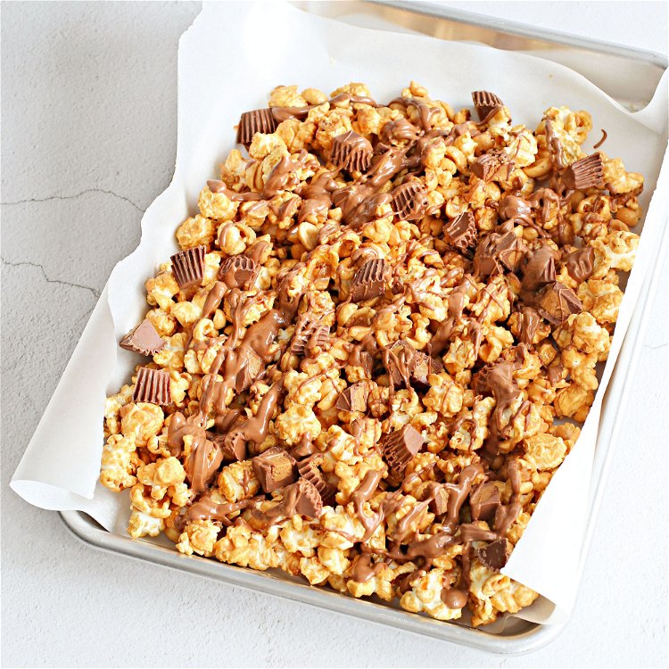 Image of Spread the popcorn out on a baking sheet lined with...