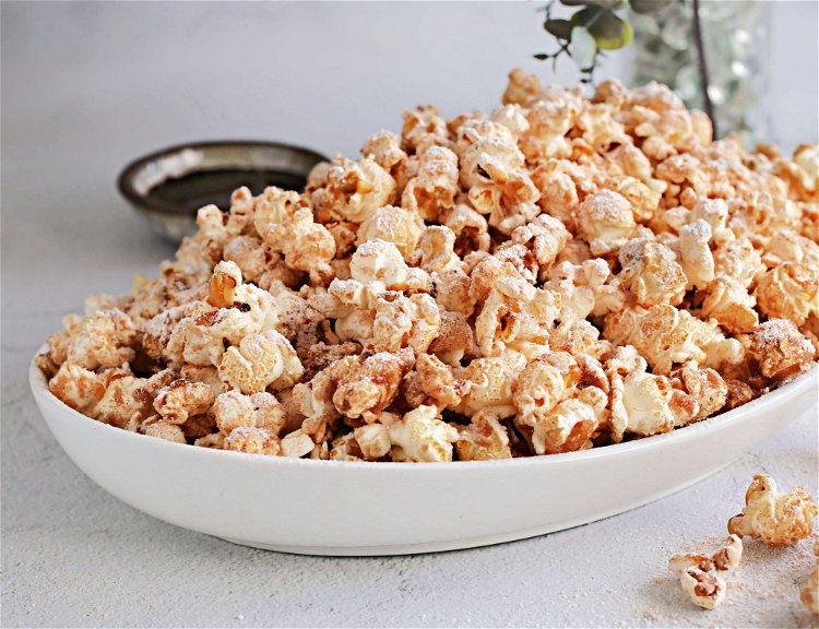 Image of Add in the popped popcorn and stir until fully coated.