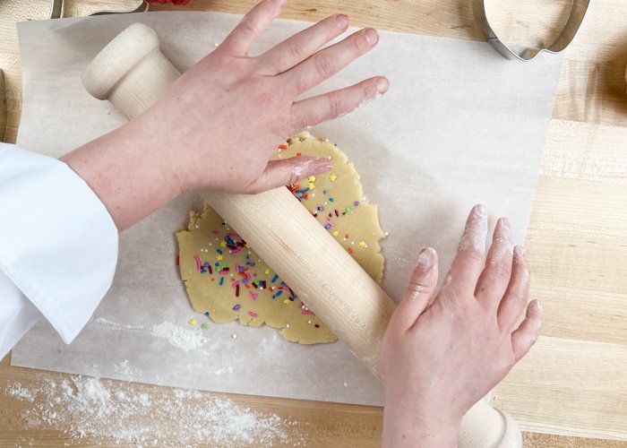 Image of Roll the dough a couple of times, just to compress the sprinkles into the dough.