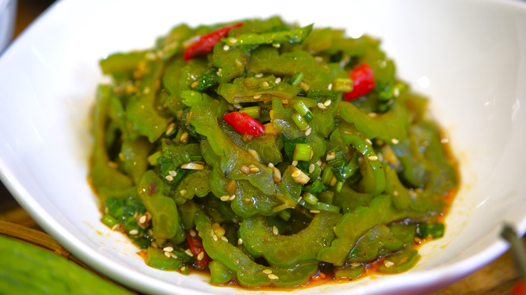 Image of This bitter melon salad has a savory dressing that balances the taste in a pleasant way. We usually serve this cold dish as a starter for dinner. You can make it ahead and keep it in the fridge. 
