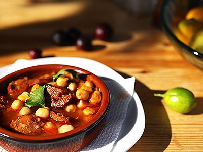 Image of Oven-Braised Chickpeas and Merguez with Yogurt and Mint