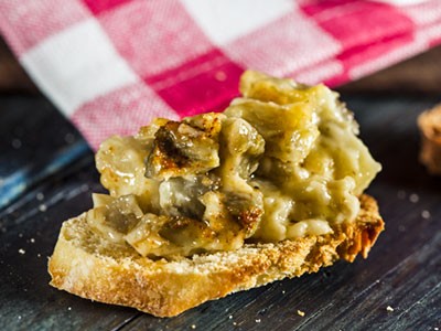 Image of Cheesy Artichoke Toasts